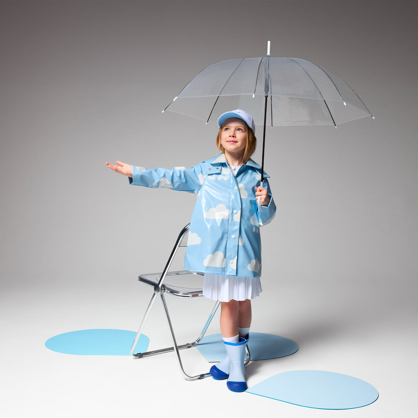Girl raincoat with cloud motif