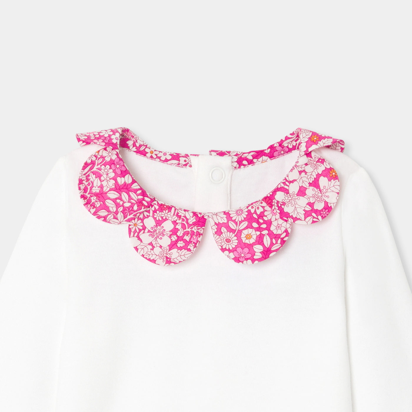 Baby girl bodysuit with petal collar