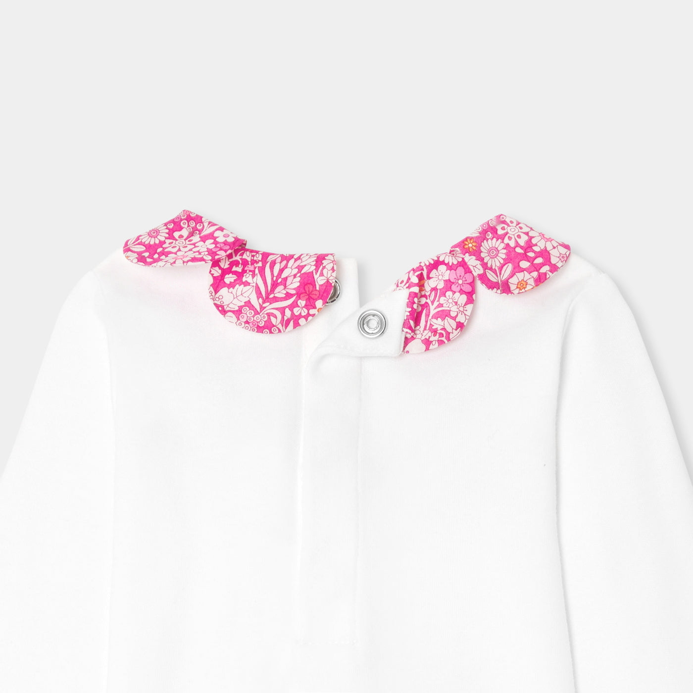 Baby girl bodysuit with petal collar