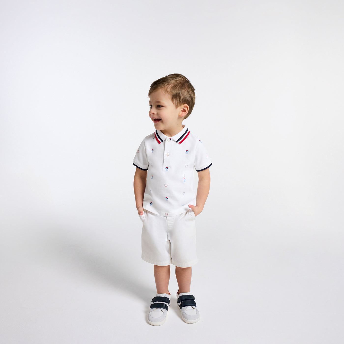Baby boy polo shirt in printed cotton piqué
